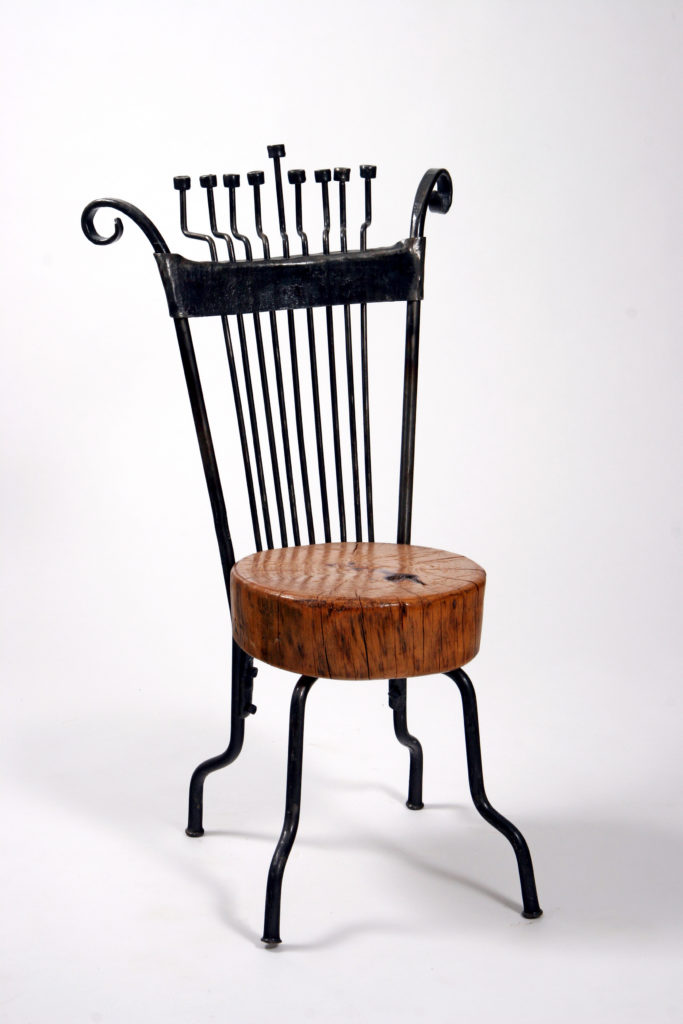 Chair Hanukah menorah - Combined with a table from Iron & Pine Tree | Artist Chanoch Ben Dov - c