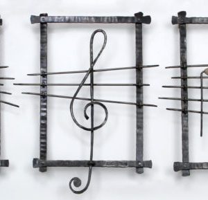 Music - Large musical notes sculpted from Iron and River Stones | Artist Chanoch Ben Dov
